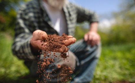 Farmer handling soil