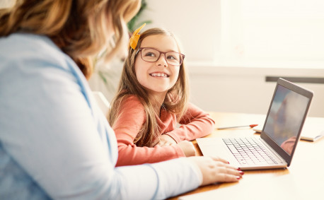 Child at computer for virtual farm tours