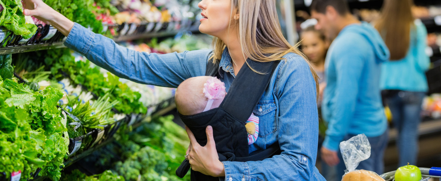 mom and baby buying vegetables