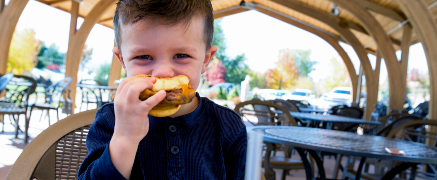 Is meat safe to eat - boy eating hamburger