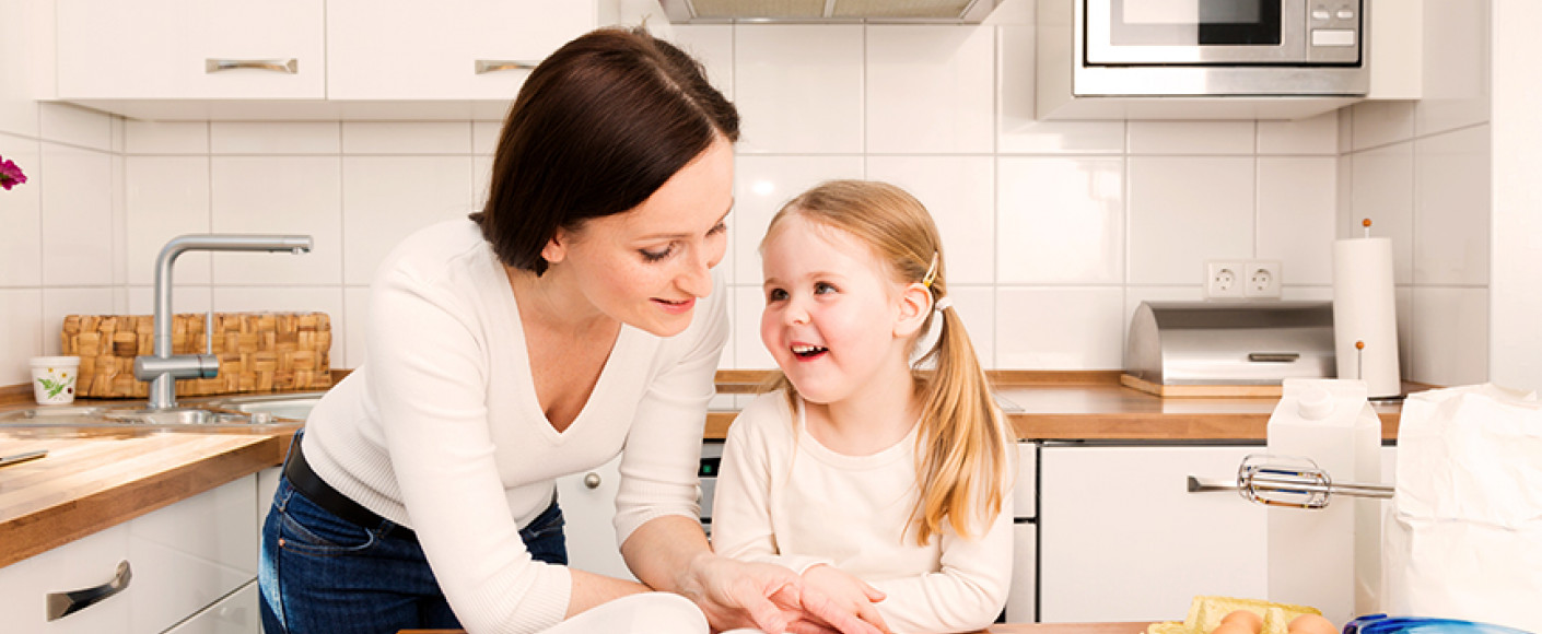 mother and daughter cooking