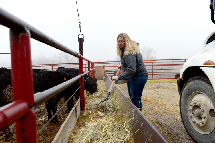 Jacquelyne Leffler feeding cattle