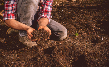 Farmer with Soil