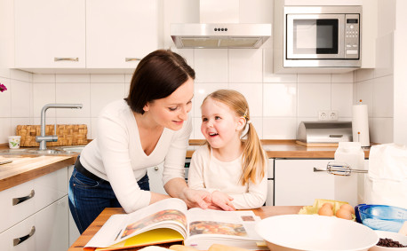 mother and daughter cooking