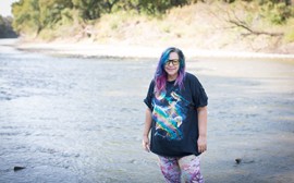 woman in front of river