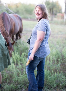 woman on farm with horse