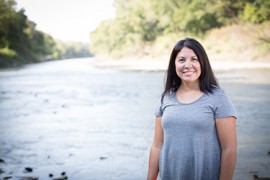 woman in front of river